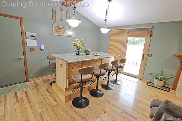 1640 High Pointe Dr, Commerce Twp, MI 48390 - dining space with vaulted ceiling and light wood-type flooring