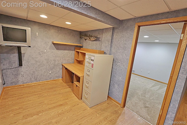1640 High Pointe Dr, Commerce Twp, MI 48390 - finished below grade area featuring wood finished floors, a paneled ceiling, and recessed lighting