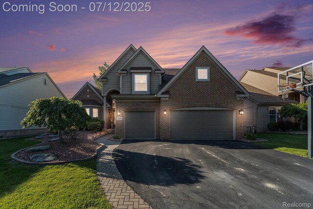 7590 Acorn Hill Ct, West Bloomfield, MI 48323 - traditional-style home with brick siding, asphalt driveway, an attached garage, and a front lawn