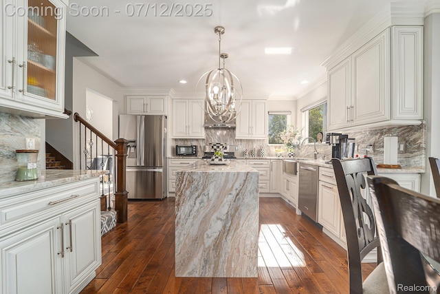 7590 Acorn Hill Ct, West Bloomfield, MI 48323 - kitchen with appliances with stainless steel finishes, light stone counters, a chandelier, dark wood-style flooring, and recessed lighting