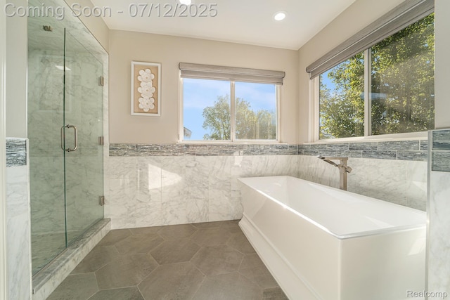 7590 Acorn Hill Ct, West Bloomfield, MI 48323 - full bath with a soaking tub, tile walls, a marble finish shower, wainscoting, and recessed lighting