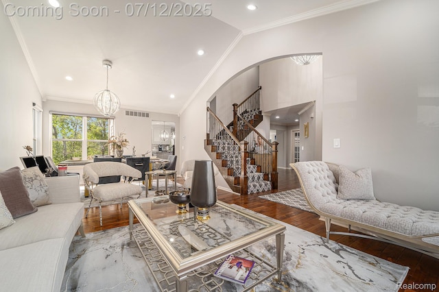 7590 Acorn Hill Ct, West Bloomfield, MI 48323 - living room featuring a chandelier, stairs, arched walkways, crown molding, and wood finished floors