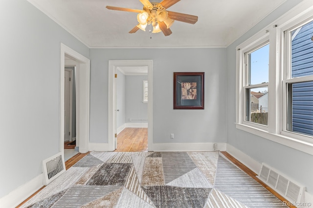 1518 Austin Ave, Lincoln Park, MI 48146 - unfurnished room with plenty of natural light, ceiling fan, ornamental molding, and wood finished floors