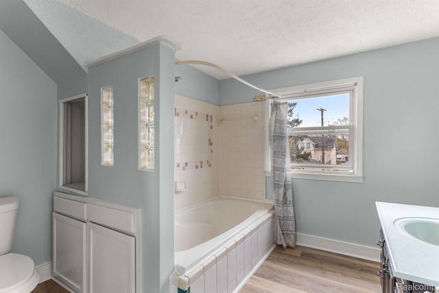 1518 Austin Ave, Lincoln Park, MI 48146 - full bath with a textured ceiling, shower / bath combo with shower curtain, vanity, and wood finished floors