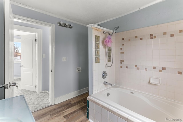 1518 Austin Ave, Lincoln Park, MI 48146 - bathroom featuring ornamental molding, tiled shower / bath combo, and wood finished floors