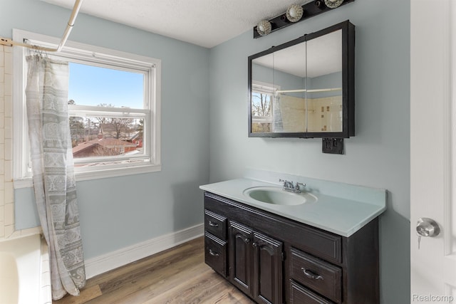 1518 Austin Ave, Lincoln Park, MI 48146 - bathroom featuring vanity, wood finished floors, shower / bath combo, and a textured ceiling