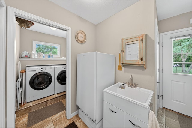 70749 Sunset Blvd, Union, MI 49130 - laundry room featuring washer and clothes dryer and plenty of natural light