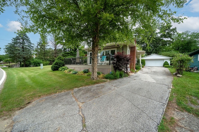 70749 Sunset Blvd, Union, MI 49130 - view of front of property featuring a detached garage, an outbuilding, and a front lawn