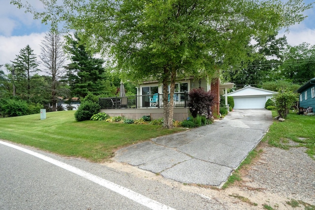 70749 Sunset Blvd, Union, MI 49130 - view of property hidden behind natural elements with an outbuilding, a garage, a front lawn, and a porch