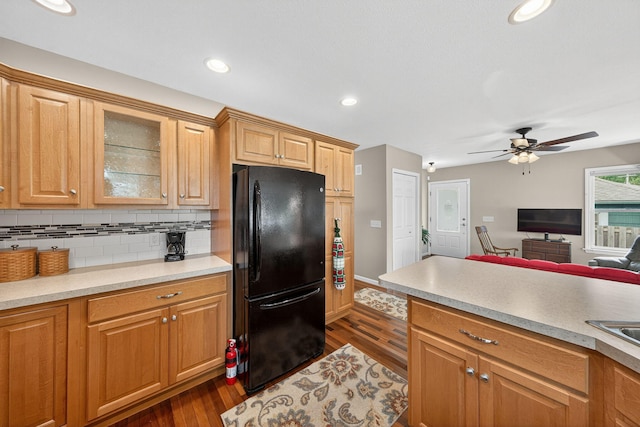 70749 Sunset Blvd, Union, MI 49130 - kitchen featuring freestanding refrigerator, dark wood-style floors, ceiling fan, glass insert cabinets, and light countertops