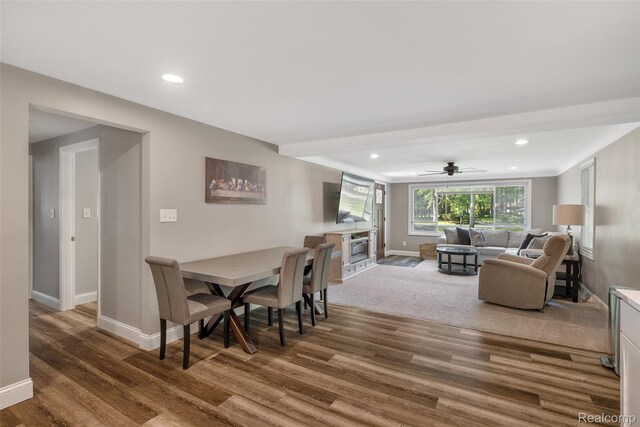 6590 Swartout Rd, Clay, MI 48001 - dining space featuring wood finished floors, recessed lighting, a fireplace, and ceiling fan