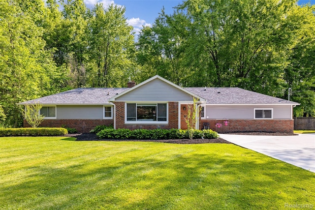 6590 Swartout Rd, Clay, MI 48001 - single story home with brick siding and a chimney
