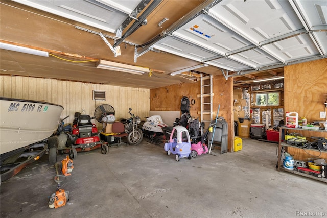 6590 Swartout Rd, Clay, MI 48001 - garage featuring wooden walls