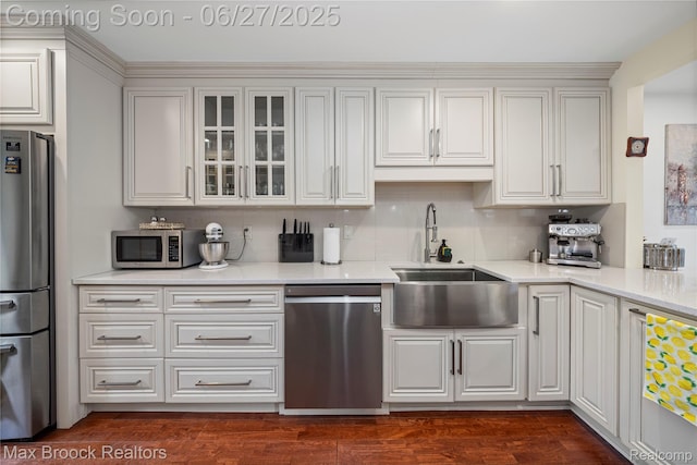31723 Forest Ln, Warren, MI 48093 - kitchen with appliances with stainless steel finishes, glass insert cabinets, light countertops, and white cabinets
