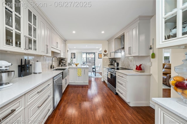31723 Forest Ln, Warren, MI 48093 - kitchen featuring stainless steel appliances, wall chimney exhaust hood, recessed lighting, healthy amount of natural light, and dark wood-type flooring