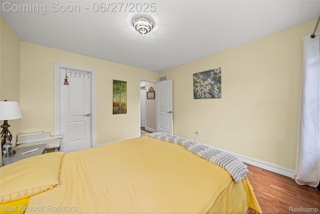 31723 Forest Ln, Warren, MI 48093 - bedroom featuring baseboards and wood finished floors