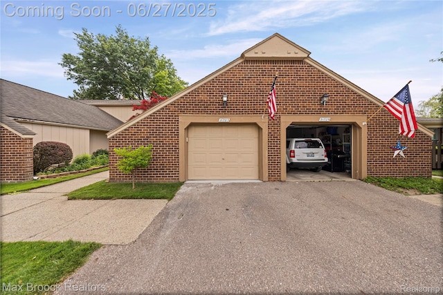 31723 Forest Ln, Warren, MI 48093 - view of front facade featuring asphalt driveway, brick siding, and a garage