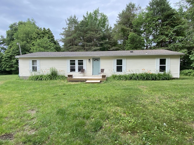 6317 E 76th St, Newaygo, MI 49337 - view of front of property with a deck and a front yard