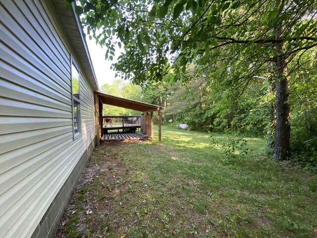 6317 E 76th St, Newaygo, MI 49337 - view of green lawn with a wooden deck