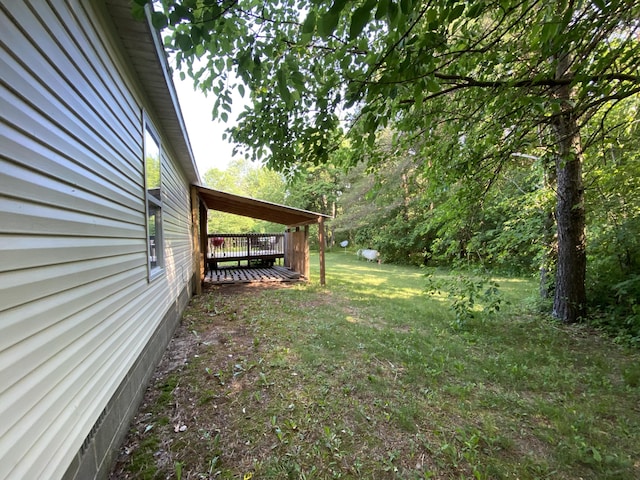 6317 E 76th St, Newaygo, MI 49337 - view of green lawn with a wooden deck