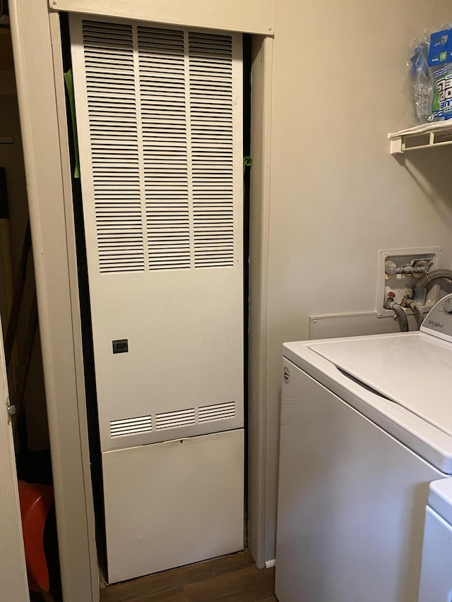 6317 E 76th St, Newaygo, MI 49337 - laundry area featuring a heating unit, dark wood-type flooring, and independent washer and dryer