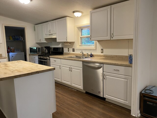 6317 E 76th St, Newaygo, MI 49337 - kitchen with appliances with stainless steel finishes, butcher block counters, under cabinet range hood, independent washer and dryer, and white cabinets