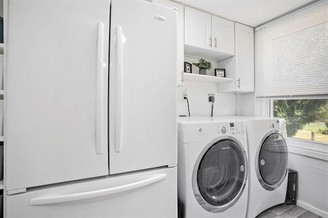 20020 T Dr S, Tekonsha, MI 49092 - laundry room featuring independent washer and dryer and cabinet space