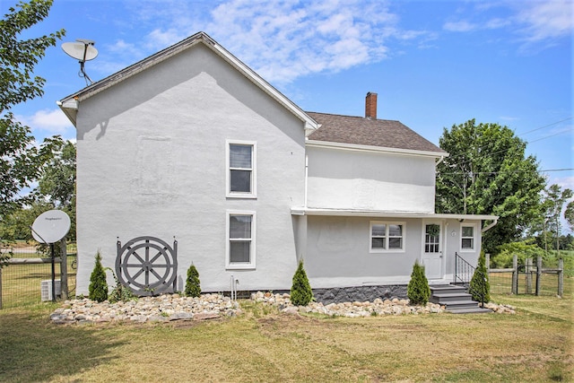 20020 T Dr S, Tekonsha, MI 49092 - back of property with stucco siding and a chimney