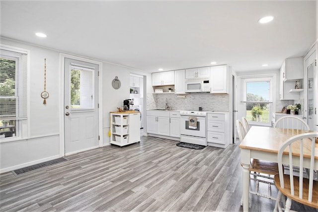 20020 T Dr S, Tekonsha, MI 49092 - kitchen with white appliances, open shelves, backsplash, white cabinetry, and recessed lighting