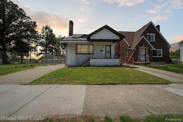 13525 Cherrylawn St, Detroit, MI 48238 - view of front of home with a chimney, brick siding, and a porch