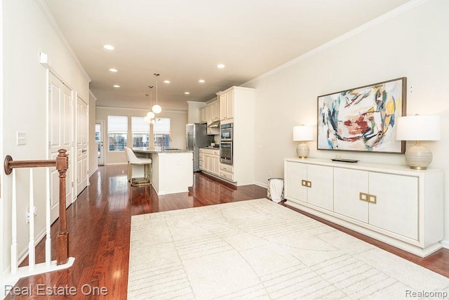 2669 Helmsdale Cir, Rochester, MI 48307 - kitchen featuring appliances with stainless steel finishes, ornamental molding, dark wood-style flooring, a kitchen breakfast bar, and recessed lighting