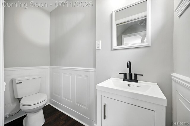 1418 W 13 Mile Rd, Royal Oak, MI 48073 - half bathroom with vanity, wainscoting, and wood finished floors