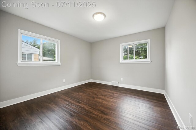 1418 W 13 Mile Rd, Royal Oak, MI 48073 - spare room with healthy amount of natural light and dark wood-type flooring