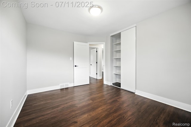 1418 W 13 Mile Rd, Royal Oak, MI 48073 - unfurnished bedroom with dark wood-style flooring and a closet