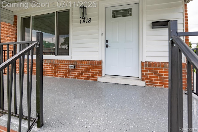 1418 W 13 Mile Rd, Royal Oak, MI 48073 - doorway to property featuring brick siding and covered porch