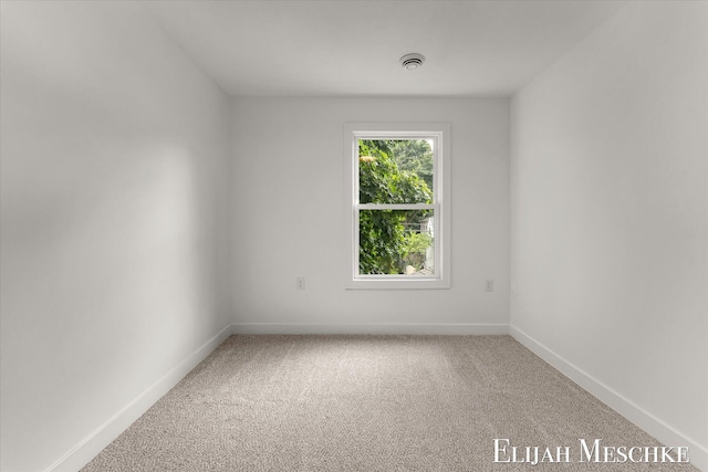 243 Page St NE, Grand Rapids, MI 49505 - empty room featuring carpet and baseboards