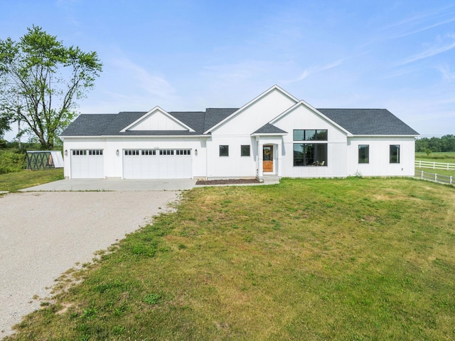 6581 Timpson Ave SE, Alto, MI 49302 - modern farmhouse style home featuring driveway and an attached garage