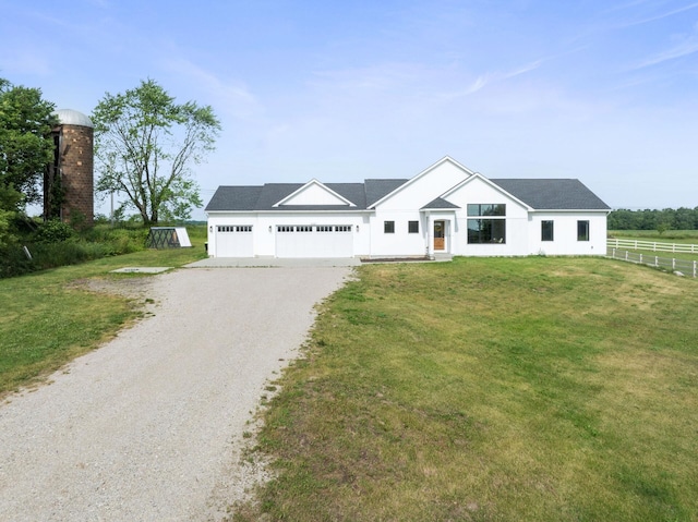 6581 Timpson Ave SE, Alto, MI 49302 - view of front of house featuring driveway and an attached garage