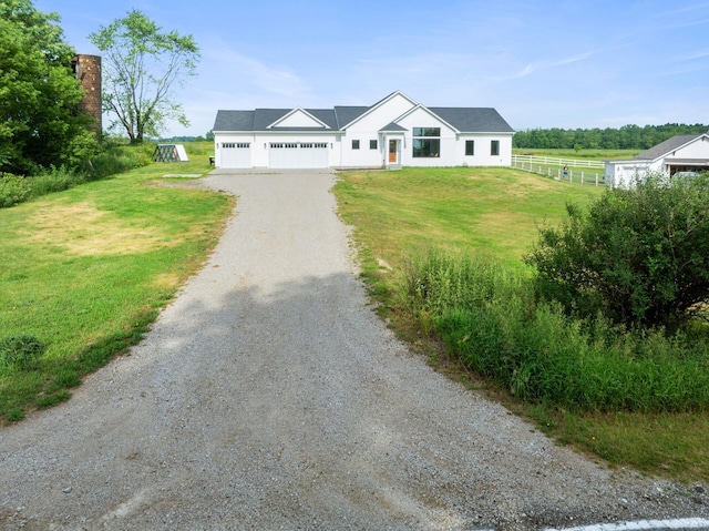6581 Timpson Ave SE, Alto, MI 49302 - view of front of house with driveway and a garage