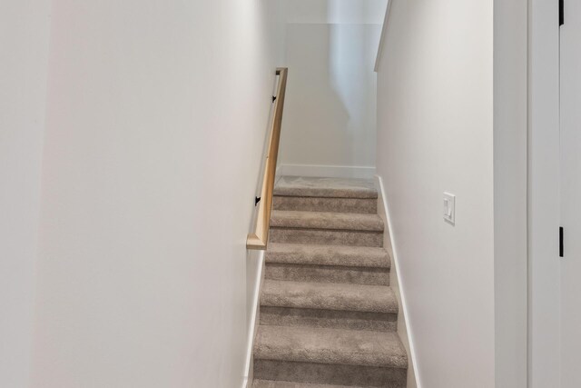 6581 Timpson Ave SE, Alto, MI 49302 - staircase featuring baseboards