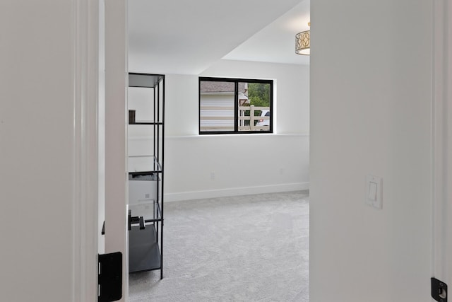 6581 Timpson Ave SE, Alto, MI 49302 - spare room featuring carpet floors and baseboards