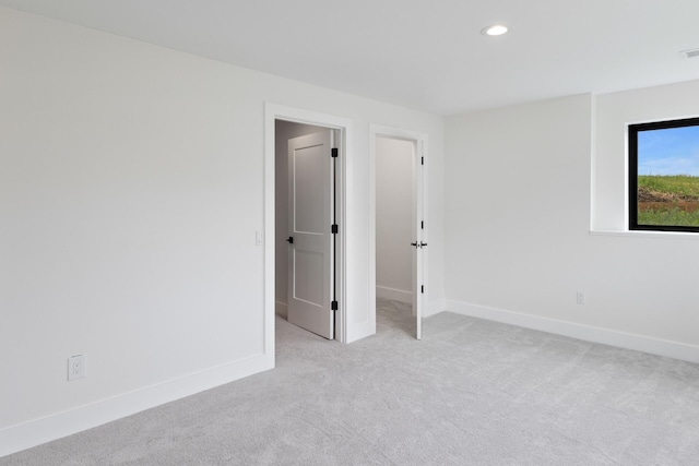 6581 Timpson Ave SE, Alto, MI 49302 - unfurnished room featuring light carpet and recessed lighting