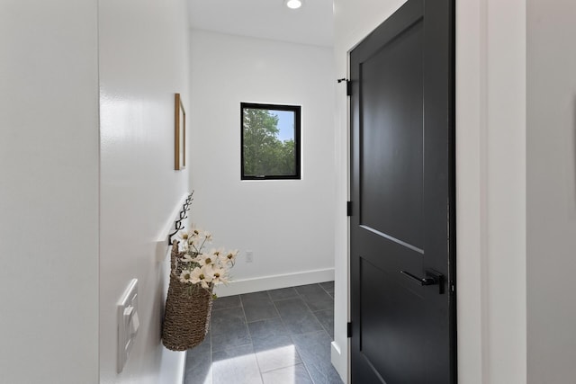 6581 Timpson Ave SE, Alto, MI 49302 - corridor with dark tile patterned floors and recessed lighting