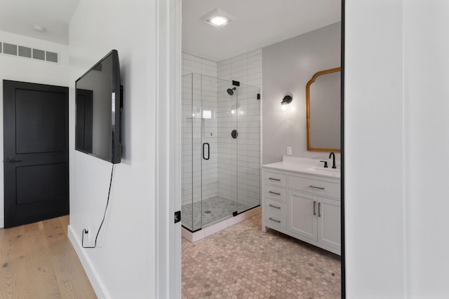 6581 Timpson Ave SE, Alto, MI 49302 - bathroom with a stall shower and vanity