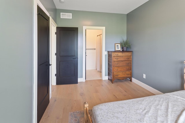 6581 Timpson Ave SE, Alto, MI 49302 - bedroom featuring light wood finished floors and baseboards