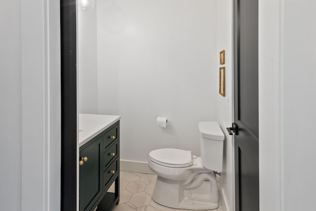 6581 Timpson Ave SE, Alto, MI 49302 - half bath featuring vanity and tile patterned floors