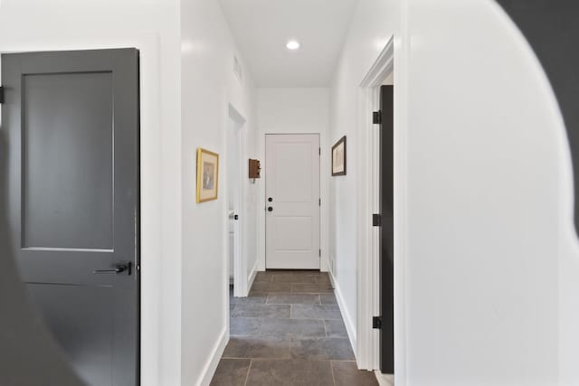6581 Timpson Ave SE, Alto, MI 49302 - hall featuring dark stone finish flooring and recessed lighting