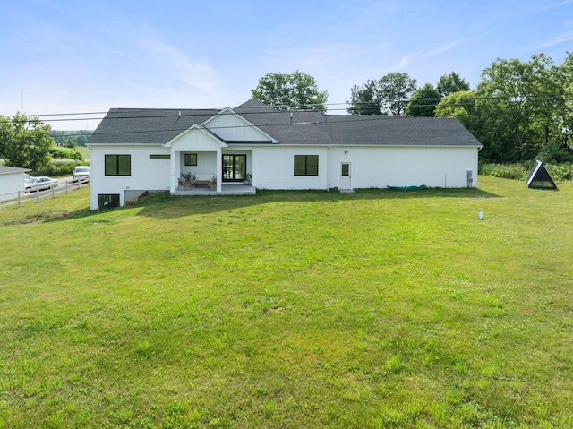 6581 Timpson Ave SE, Alto, MI 49302 - rear view of property featuring board and batten siding and a patio area