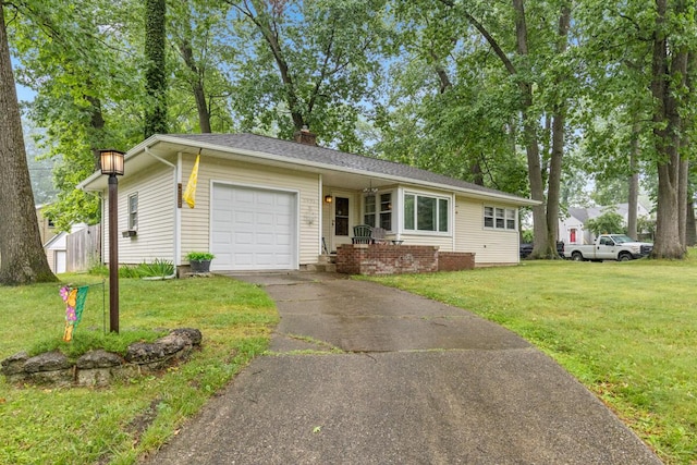 2925 Dawes Ave SE, Grand Rapids, MI 49508 - view of front facade featuring an attached garage, a front yard, asphalt driveway, and a chimney