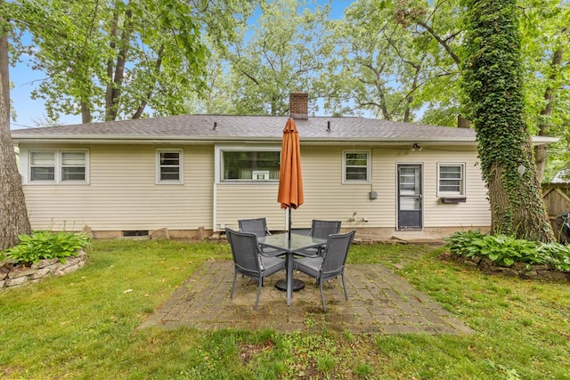 2925 Dawes Ave SE, Grand Rapids, MI 49508 - rear view of house featuring a patio area, a chimney, and a lawn